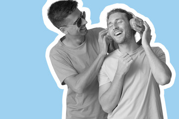 Happy gay couple listening to music on blue background