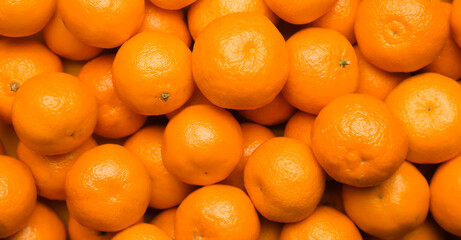 Many sweet tangerines as background, top view