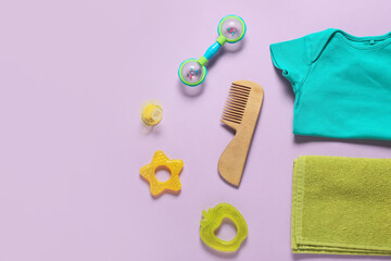 Accessories for baby and soft towel on color background