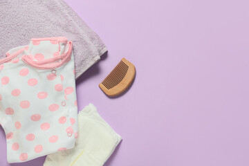 Baby accessories and soft towel on color background