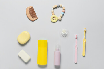 Different bath accessories for baby on light background