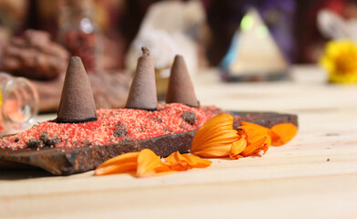Incense Cones on Stone Slab With Crystals and Flowers