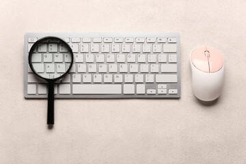 Keyboard, mouse and magnifier on light background. Concept of search