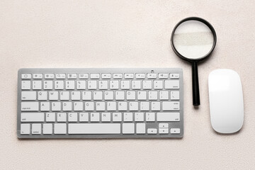 Keyboard, mouse and magnifier on light background. Concept of search