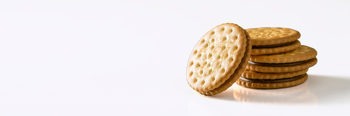 Sandwich biscuits cookies with chocolate filling on white background for banner with copy space. Crackers with cream