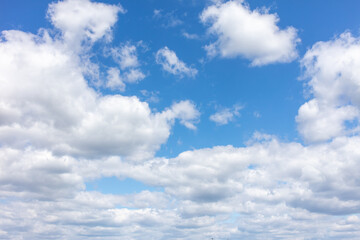 Fototapeta na wymiar White clouds against the blue sky.