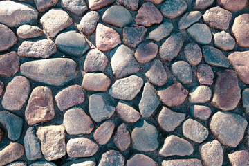 Pavement made of stones as a background.