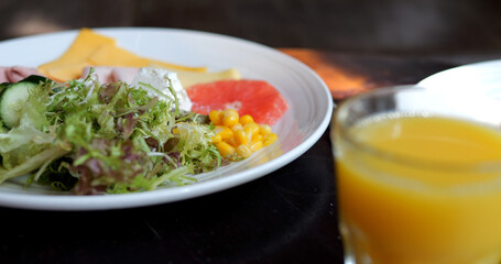 Full of food plate with orange juice