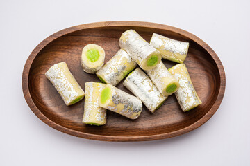 Kaju Pista Roll Or Cashew Pistachio Rolls Mithai or sigar, Indian sweet or dessert for festivals