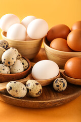 Different eggs on color background, closeup