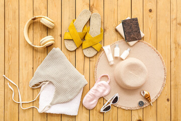 Female accessories for travelling with passport on wooden background