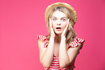 Summer Concepts. Smiling Surprised Winsome Caucasian Female Girl Showing Excitement While Wearing Straw Hat Posing  Over Coral Pink Background.