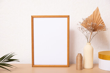 Mock up empty wooden frame mockup, dried pampas grass and palm leaves on white background,...
