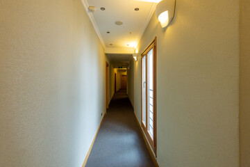 Interior of a hotel corridor with doors with room nummbers