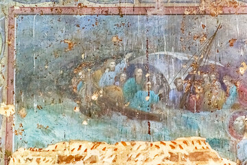 pictures on the wall of an abandoned temple