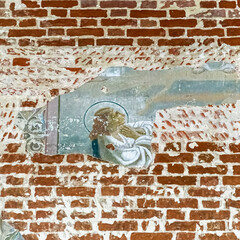 pictures on the wall of an abandoned temple