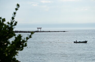 the Torii on the ocean.
the shrine beside beach.