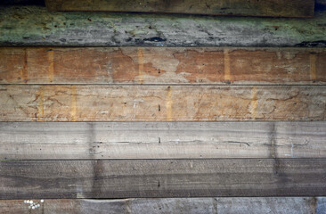 An old, rough and dirty wooden plank wall picture for use as a background.