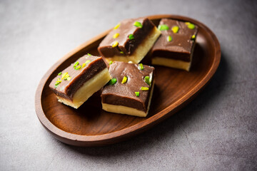 Choco Vanilla Pateesa or chocolate mawa barfi or or two layered burfi, Indian sweet or dessert