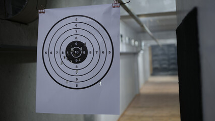 Round target with marked bulls-eye for shooting practice and shots