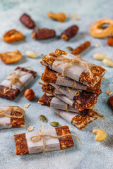Variety of cereal or granola bars with dried fruits,nuts and seeds.