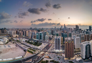 Naklejka na ściany i meble Aerial view on Abu Dhabi cityscape at sunset