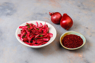 Red onion with sumac, salt and lemon juice.