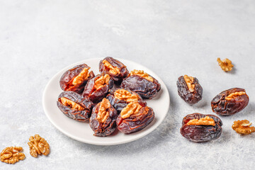 Fresh organic and various sweet dried date fruits.