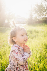 little girl in a field of flowers