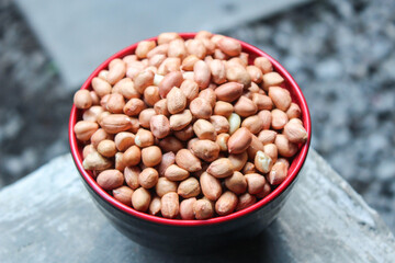 bunch of peeled peanuts or beans in a bowl best for agricultural and food bacground.