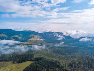 Low Clouds Over the Summer Valley. Aerial View