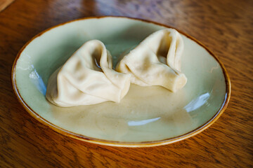 a khinkali in a plate. Georgian cuisine.