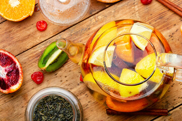 Fruit tea with citrus, tea kettle