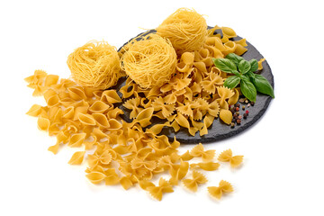 Tagliatelle pasta nests with farfalle and Conchiglie rigate pasta, isolated on white background.