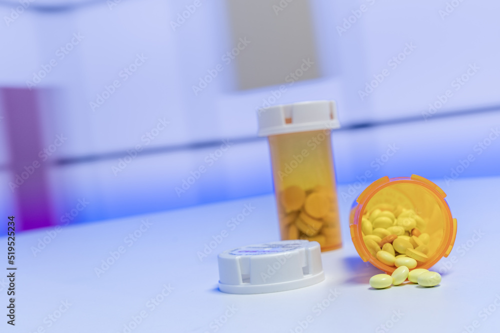 Wall mural Colorful tablets with capsules and pills on blue background