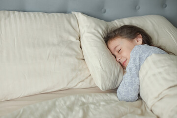 Cute girl sleeping in bed