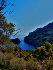 Beautiful view on the sea next to a huge mountain on the pretty island mallorca.