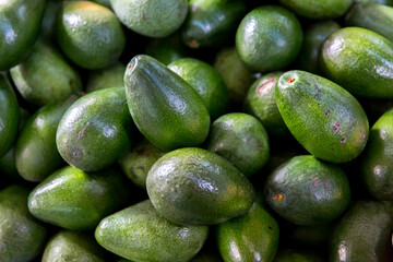 Avocados standing on the market stall