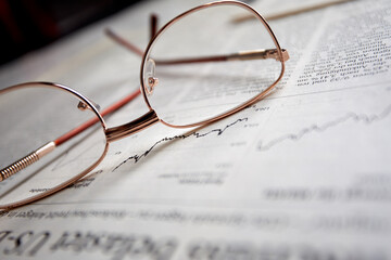 eyeglasses on the newspaper pages