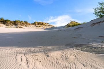 High sand dunes. Picturesque sea shores.