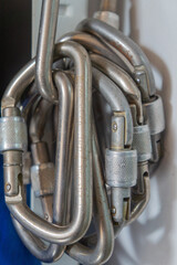 Carabiners for mountaineering and rock climbing on a workbench