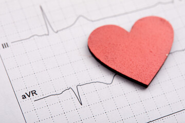 Printed ECG, as background, red heart