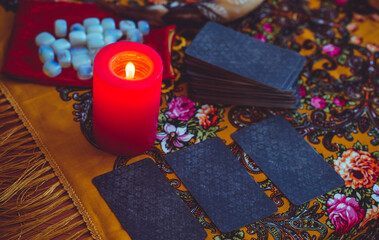 Magical scene, esoteric concept, fortune telling, tarot cards on a table	