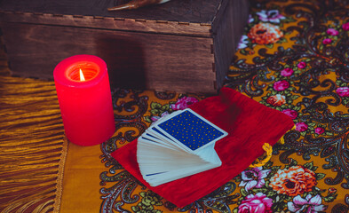 Magical scene, esoteric concept, fortune telling, tarot cards on a table	