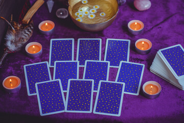 Magical scene, esoteric concept, fortune telling, tarot cards on a table	