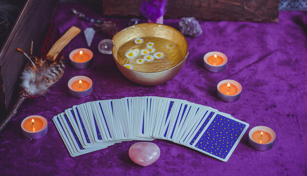 Magical scene, esoteric concept, fortune telling, tarot cards on a table	