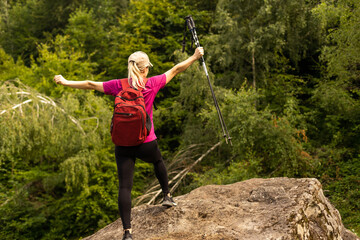 Fototapeta na wymiar Fit woman walking on the mountain. Healthy lifestyle concept