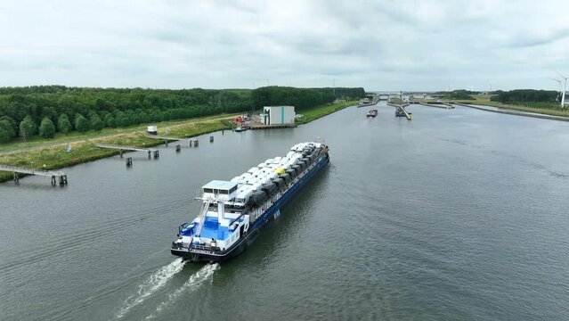 Vehicles Transported by Boat Entering the Volkerak Lock in the Netherlands