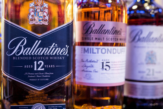 Ballantine's 12 Years Old blended scotch whisky with other versions for sale at a liquor store.