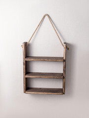 Brown empty wooden shelf. Order and organization of space in the kitchen, bathroom or living room